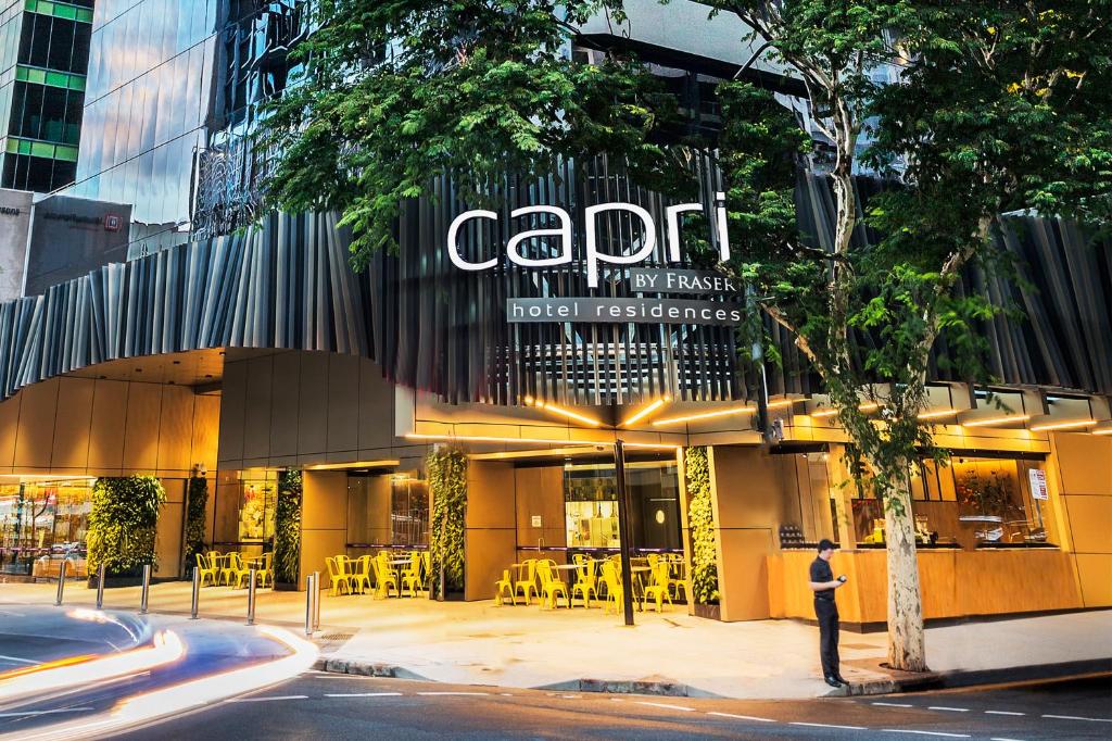 a large building with a sign on the side of it at Capri by Fraser Brisbane in Brisbane