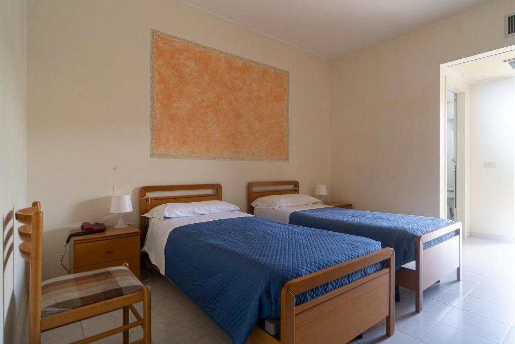 Postel nebo postele na pokoji v ubytování Hotel La Fonte a 300m uscita A14 Pescara Nord