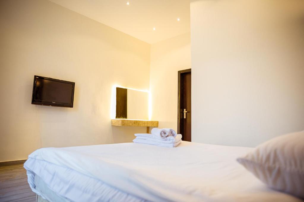 Postel nebo postele na pokoji v ubytování Tourist Palace Hotel