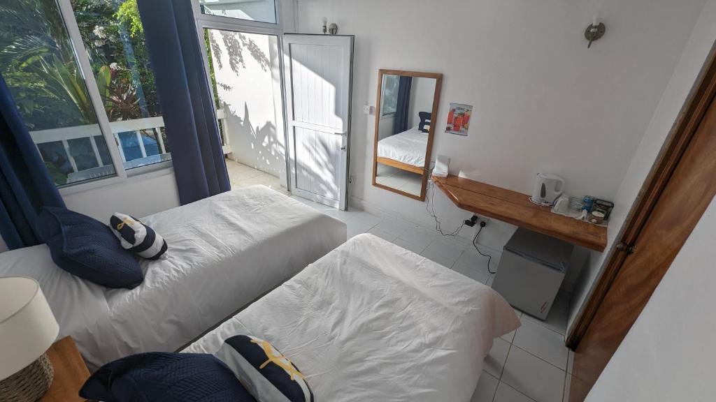 Postel nebo postele na pokoji v ubytování OEManagement Rooms