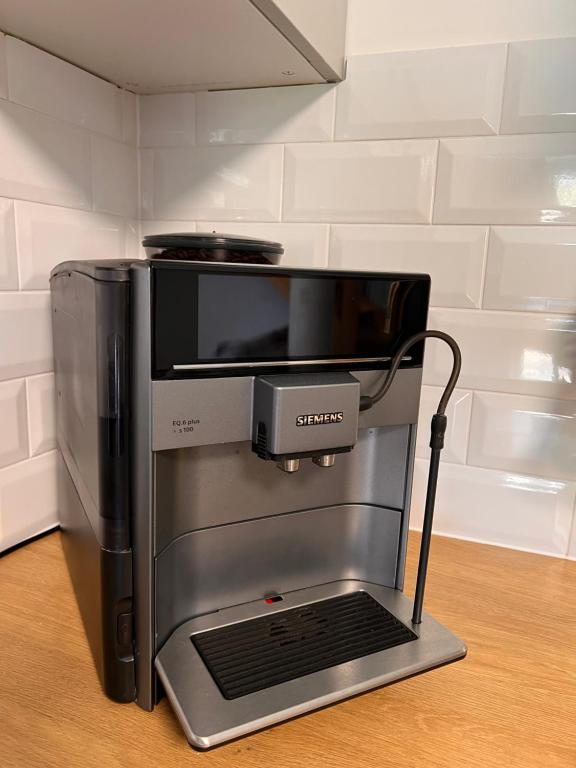 a coffee maker sitting on top of a table at Apartamenty Żary in Żary