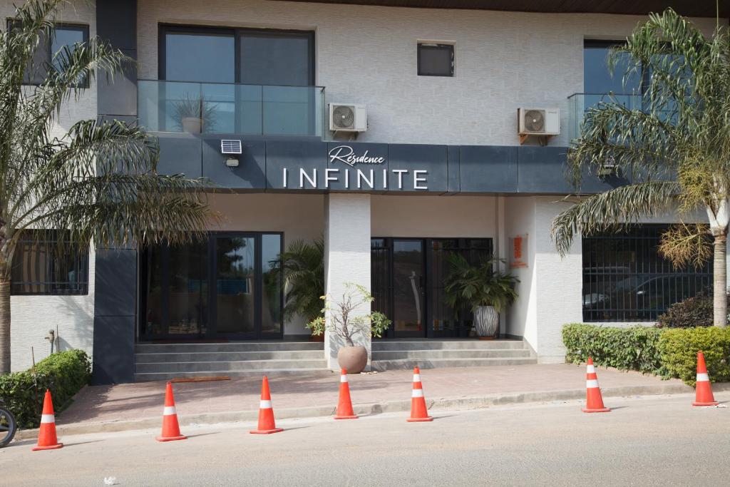 a group of orange cones in front of a building at Residence INFINITE in Dakar