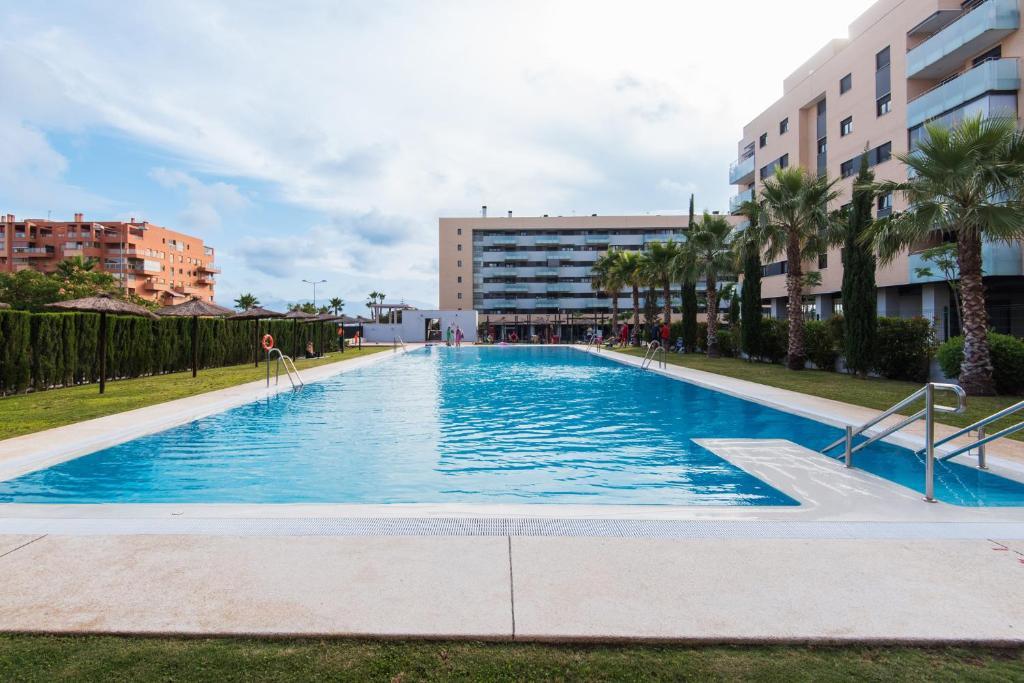 Bazén v ubytovaní UNIVERSITY & TECH PARK MALAGA APARTMENT alebo v jeho blízkosti