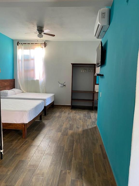 Postel nebo postele na pokoji v ubytování Casa Suites Minizoo