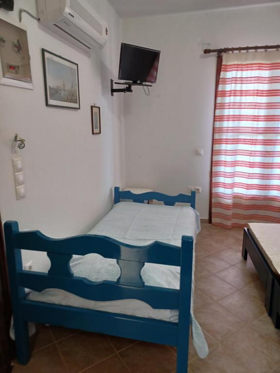 Postel nebo postele na pokoji v ubytování LALAROUS Studios & Apartments