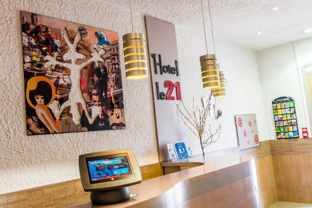TV a/nebo společenská místnost v ubytování Hotel Le 21
