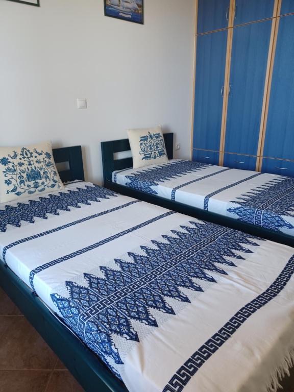 Postel nebo postele na pokoji v ubytování LALAROUS Studios & Apartments