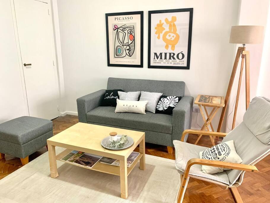 a living room with a couch and a coffee table at flat in Buenos Aires in Buenos Aires