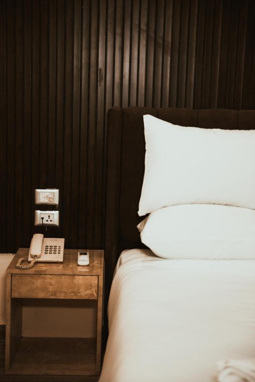 Postel nebo postele na pokoji v ubytování Tourist Palace Hotel