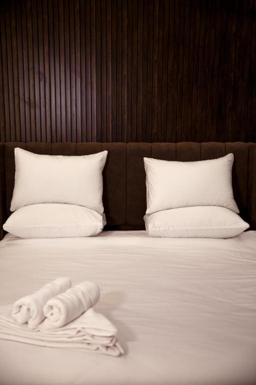 Postel nebo postele na pokoji v ubytování Tourist Palace Hotel