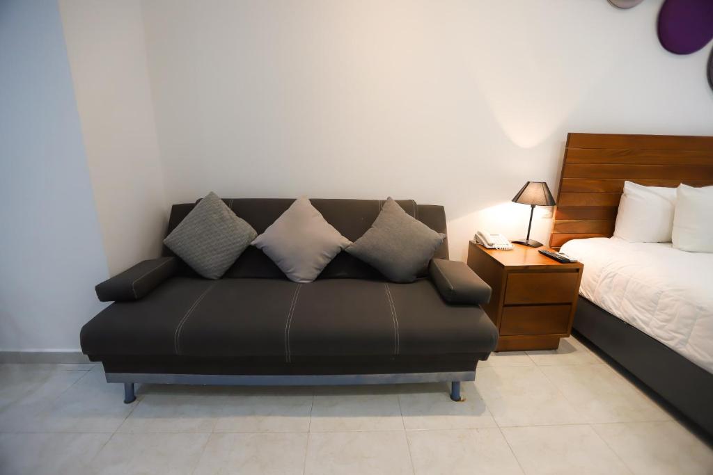 Postel nebo postele na pokoji v ubytování TRYP by Wyndham Chetumal