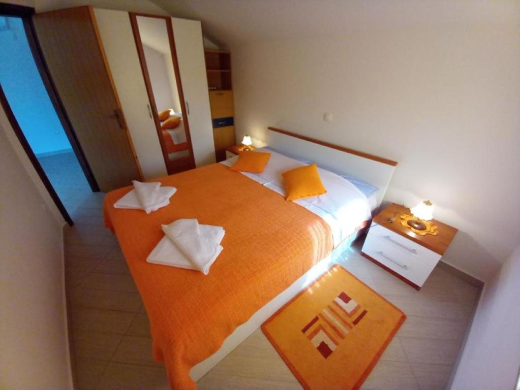 Posteľ alebo postele v izbe v ubytovaní Apartmani Gracijela