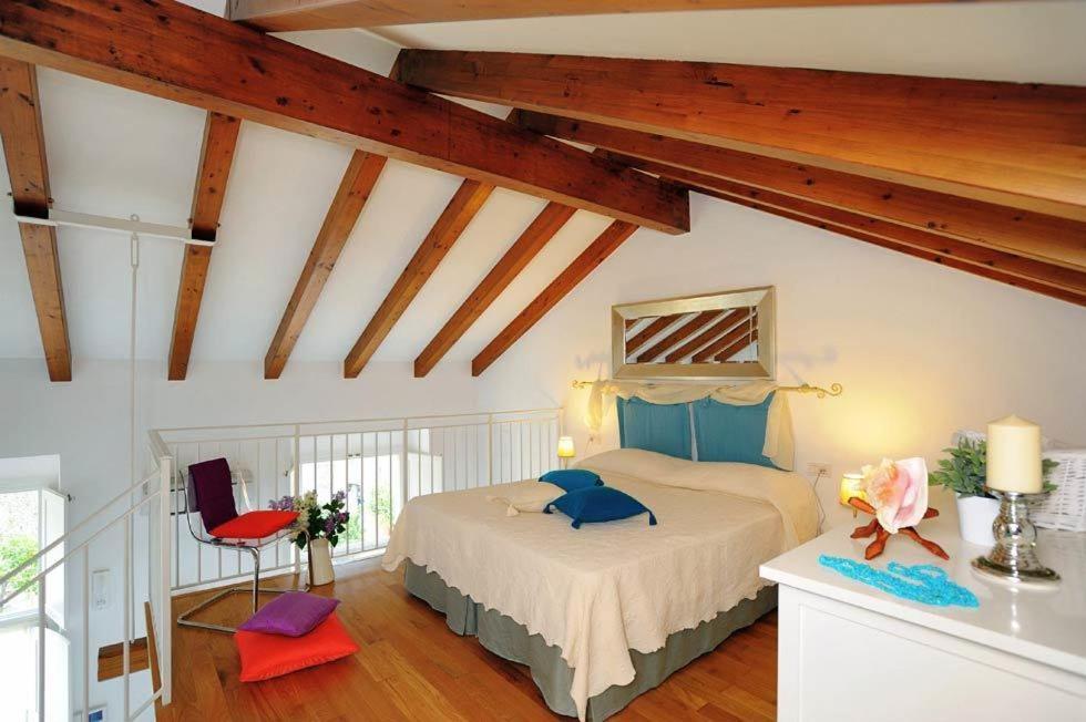 Postel nebo postele na pokoji v ubytování Loft Apartments by AMALFIVACATION
