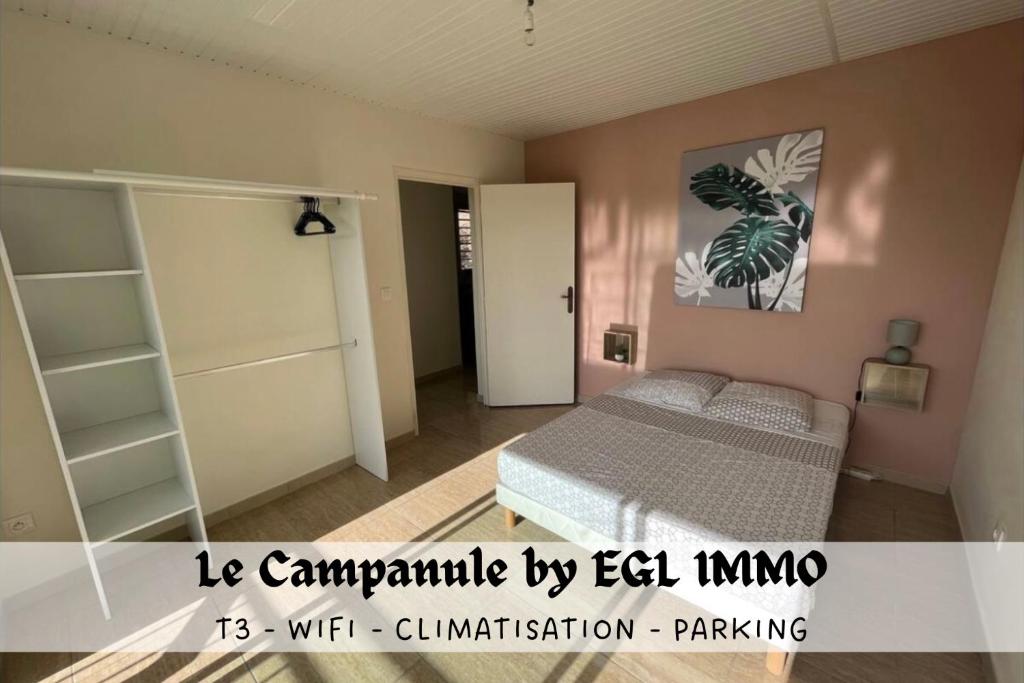 Een bed of bedden in een kamer bij Le Campanule by EGL IMMO
