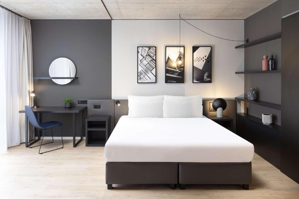 Postel nebo postele na pokoji v ubytování Radisson Hotel & Suites Zurich