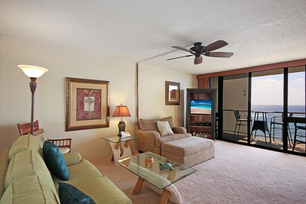 a living room with a couch and a table at Kuhio Shores 416 in Koloa
