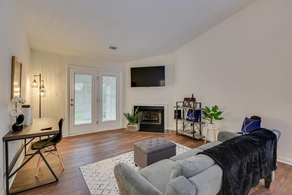 a living room with a couch and a fireplace at Serene Sanctuary Near I-20 in Augusta