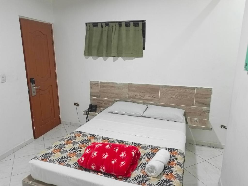 Postel nebo postele na pokoji v ubytování Hotel Brisas MEDELLIN
