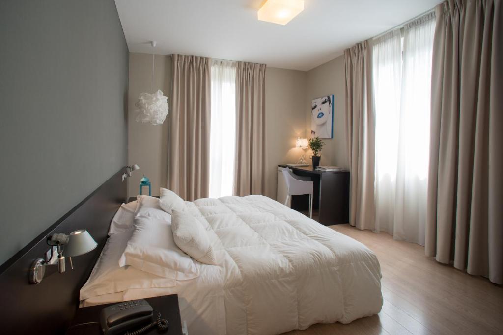 Postel nebo postele na pokoji v ubytování Berghotel