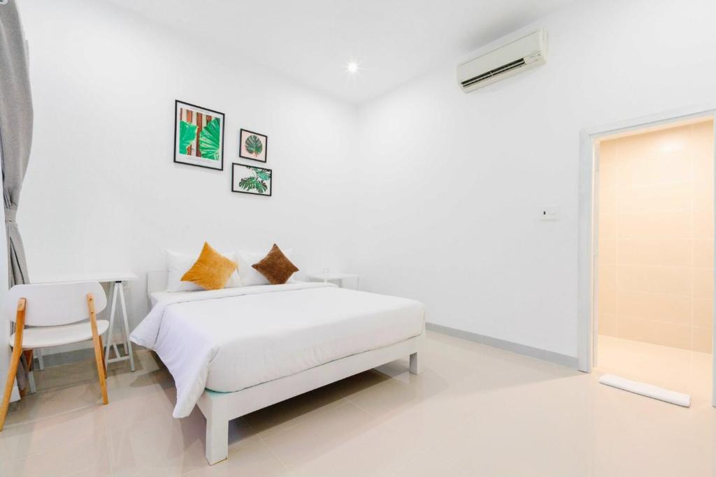 Giường trong phòng chung tại Philip Bungalow