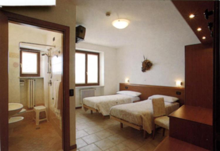 Postel nebo postele na pokoji v ubytování Hotel Scandola