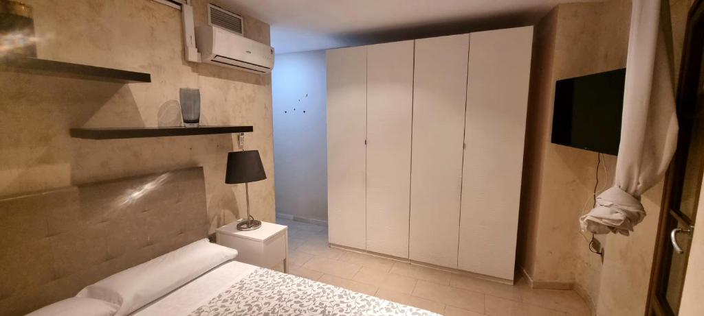 A bed or beds in a room at Apartamentos Salamanca