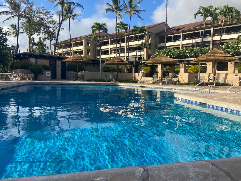 a large swimming pool in front of a building at Kaanapali Royal Golf Retreat in Lahaina