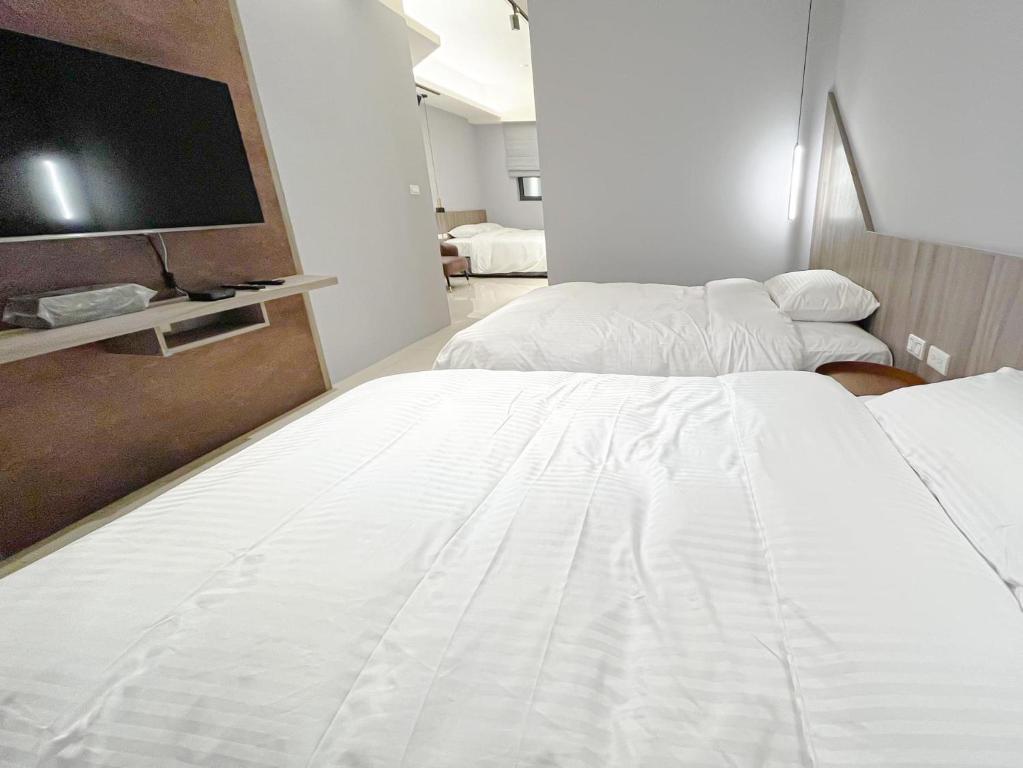 Postel nebo postele na pokoji v ubytování 飛鳥集行館