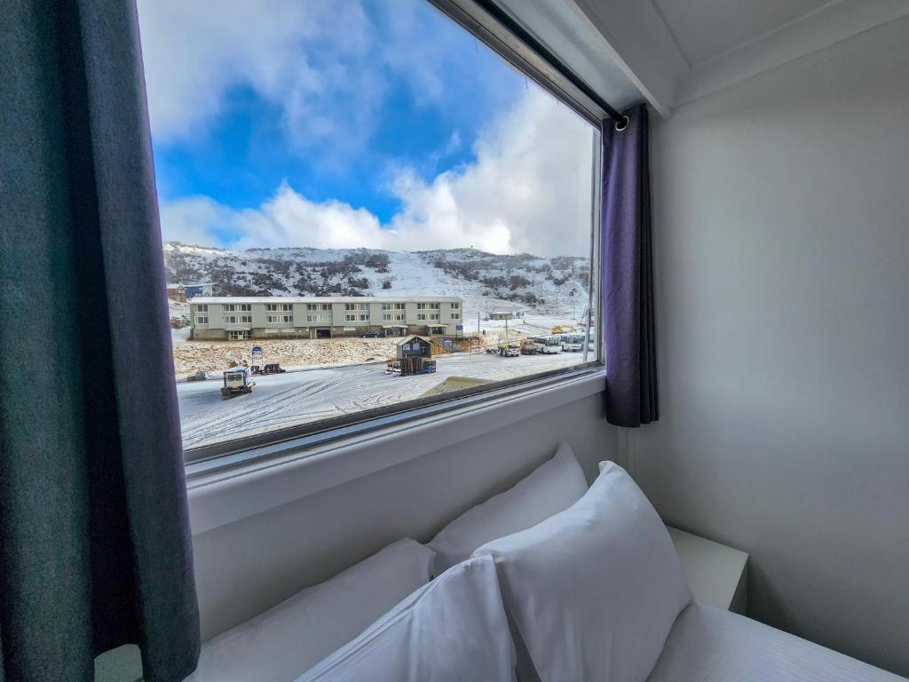 a window in a room with a view of a street at Lodge 21 in Perisher Valley