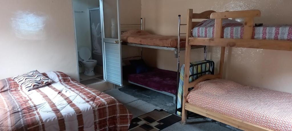 Postel nebo postele na pokoji v ubytování Montano Camping & Hostel
