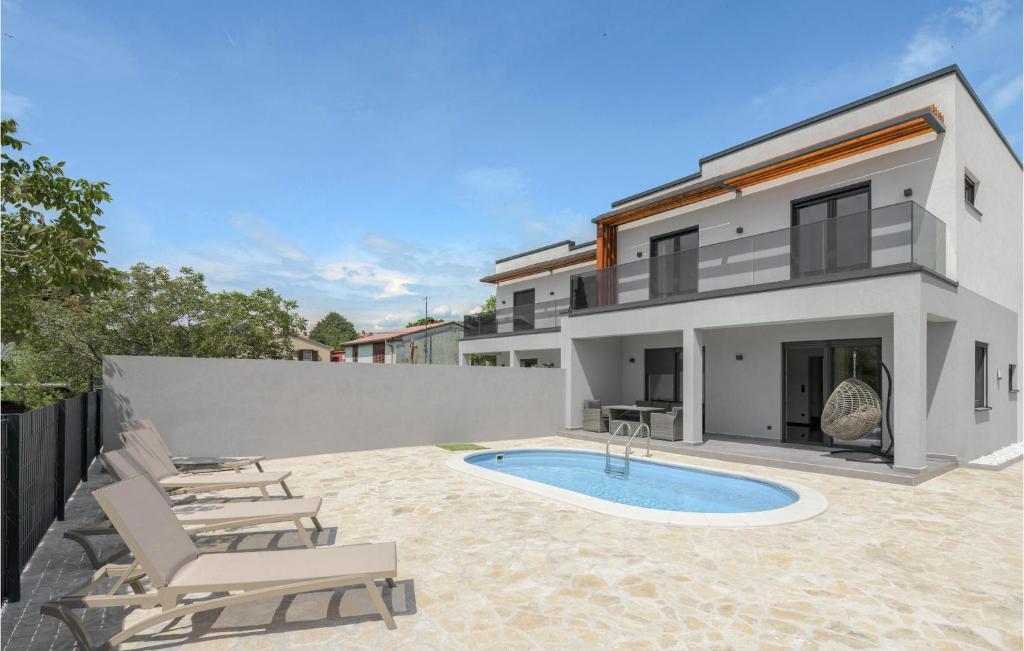 an image of a house with a swimming pool at Gorgeous Home In Labin in Labin