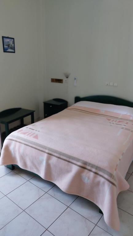 Postel nebo postele na pokoji v ubytování Hellas