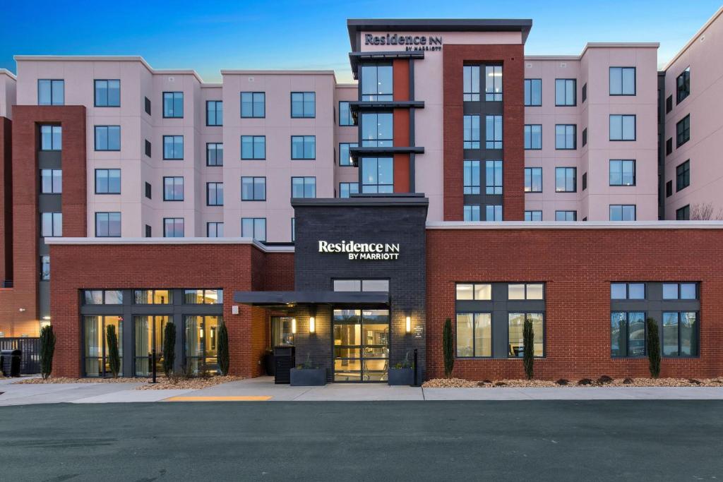 a rendering of a red brick building with a hotel at Residence Inn by Marriott Atlanta Covington in Covington