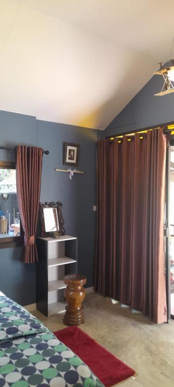 Postel nebo postele na pokoji v ubytování บ้านลูกจัน Bann Lookjan Trat
