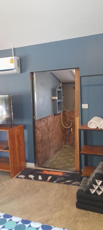 Postel nebo postele na pokoji v ubytování บ้านลูกจัน Bann Lookjan Trat