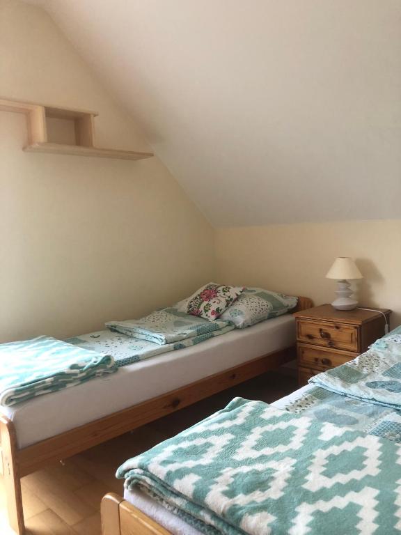 Postel nebo postele na pokoji v ubytování Zamajerz Nad Zalewem