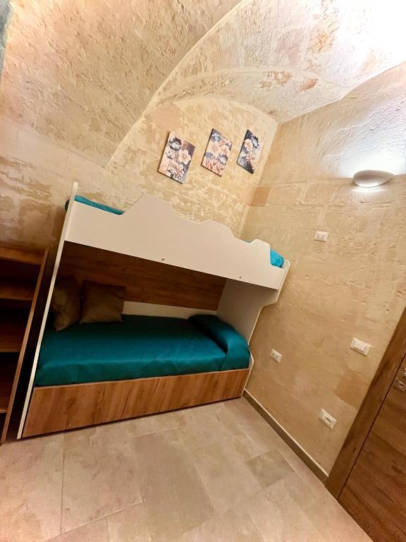 Postel nebo postele na pokoji v ubytování Antica Dimora "Lu suli, Lu mari, Lu jentu"