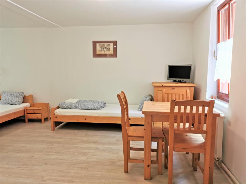 Postel nebo postele na pokoji v ubytování Penzion Liškův Mlýn