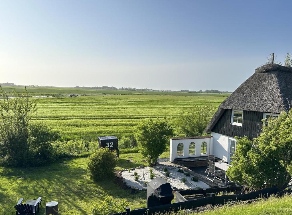 an aerial view of a house with a grass roof at Loft32 in Nordstrand