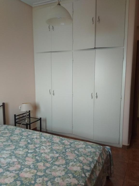 Postel nebo postele na pokoji v ubytování THEO house in Kyllini Zakynthos