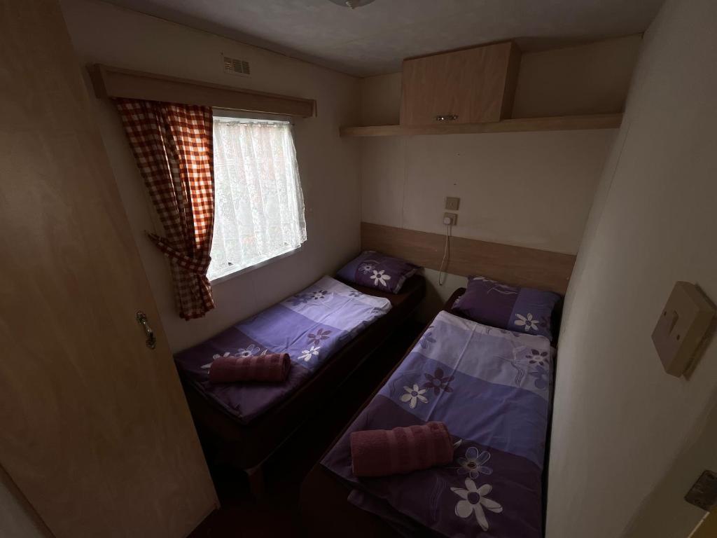 Postel nebo postele na pokoji v ubytování Autocamp Free Star - Mobilheimy