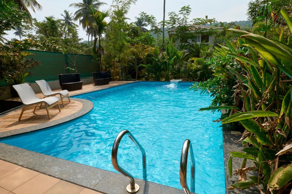 Bazén v ubytování Fig House Anjuna-Chapora Road , Siolim 1BHK Suite nebo v jeho okolí