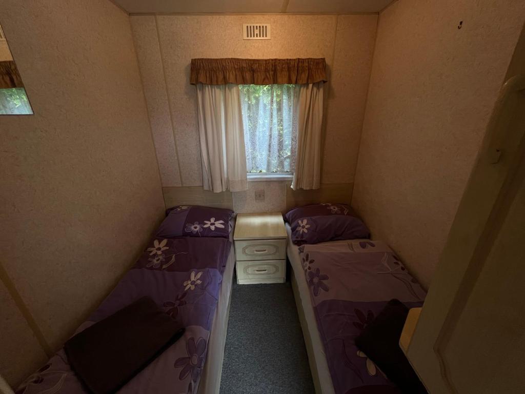 Postel nebo postele na pokoji v ubytování Autocamp Free Star - Mobilheimy