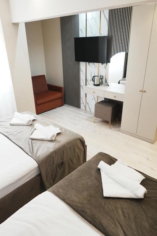 A bed or beds in a room at Reyyan Hotel