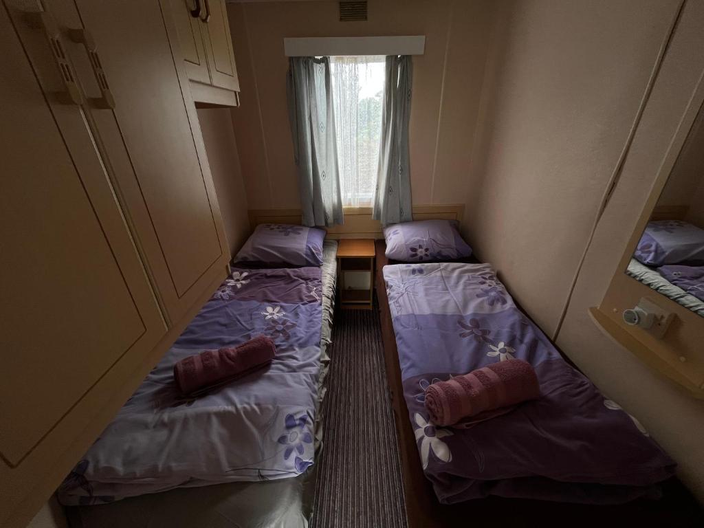 Postel nebo postele na pokoji v ubytování Autocamp Free Star - Mobilheimy