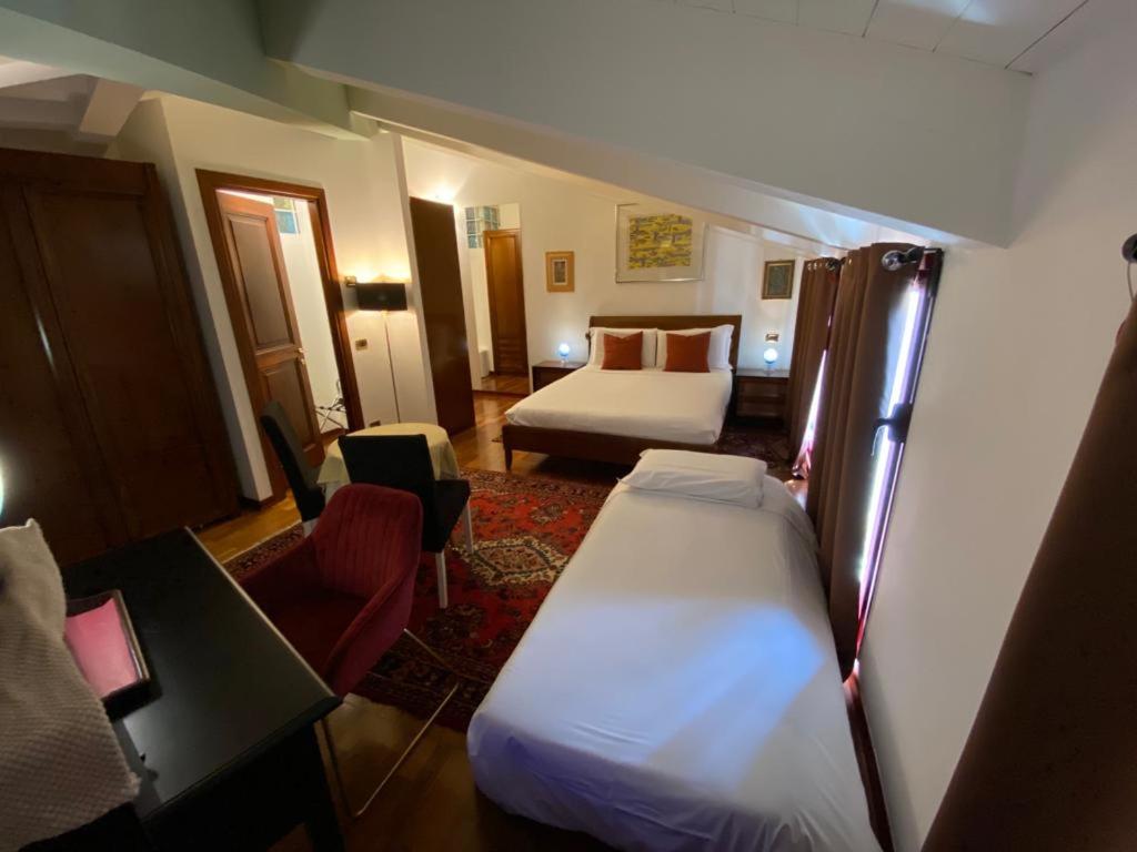 A bed or beds in a room at Ego' Residence Ferrara