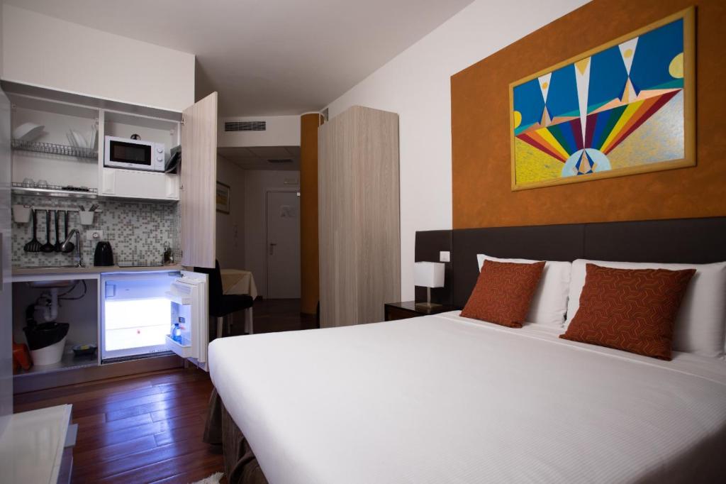 A bed or beds in a room at Ego' Residence Ferrara