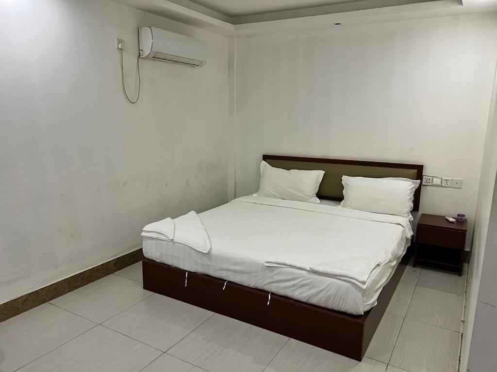 Postel nebo postele na pokoji v ubytování Yaou Hotel