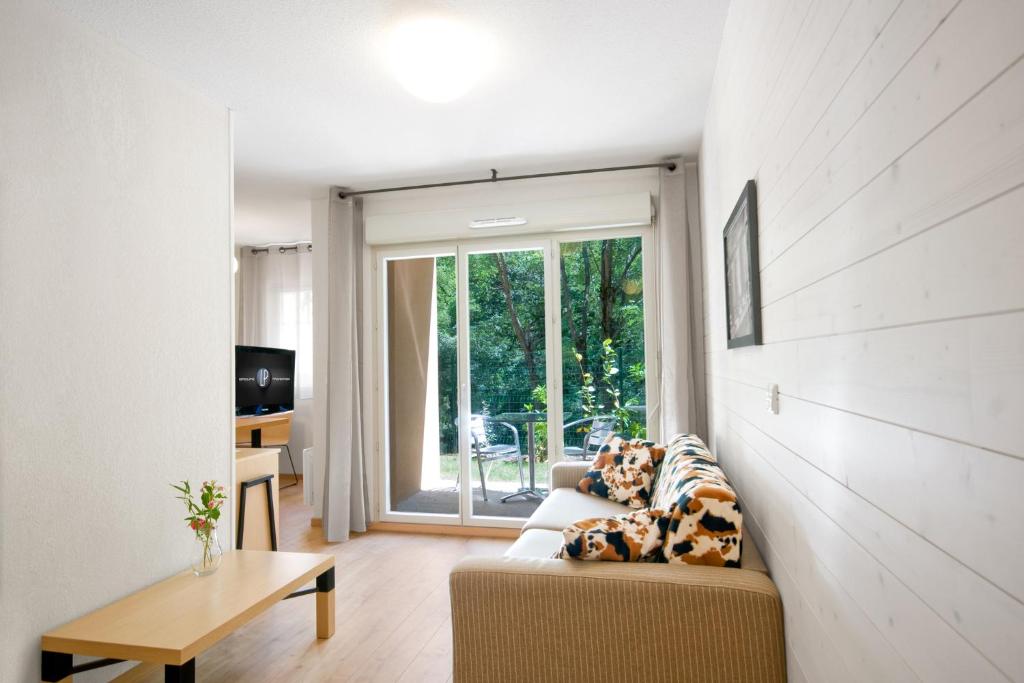 Posezení v ubytování Lagrange Vacances Les Chalets d’Ax