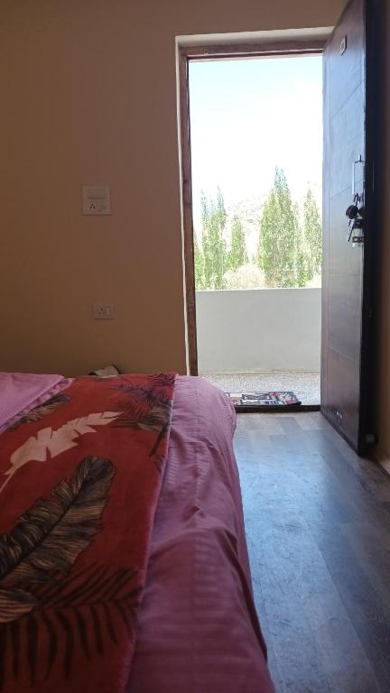 Letto o letti in una camera di Gonbo Guest House